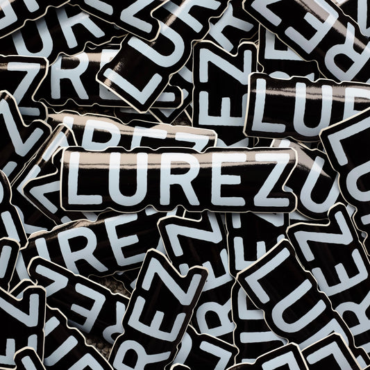 Stack of black and white 'LUREZ' branded stickers.